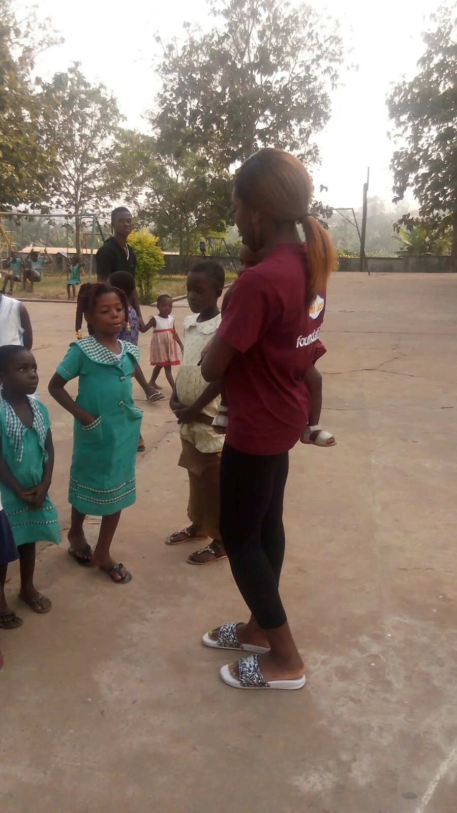  Team member plays with children in the orphanage. 