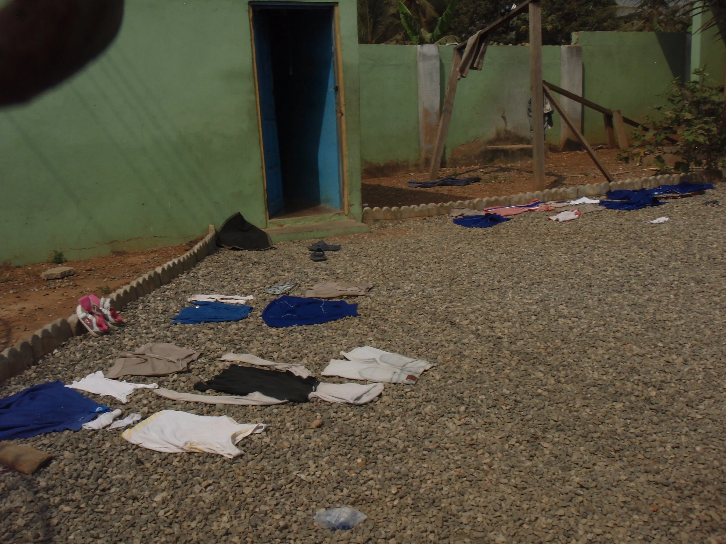  No clothes line at (HC) orphanage Ghana. So clean clothes are spread on the ground to dry. 