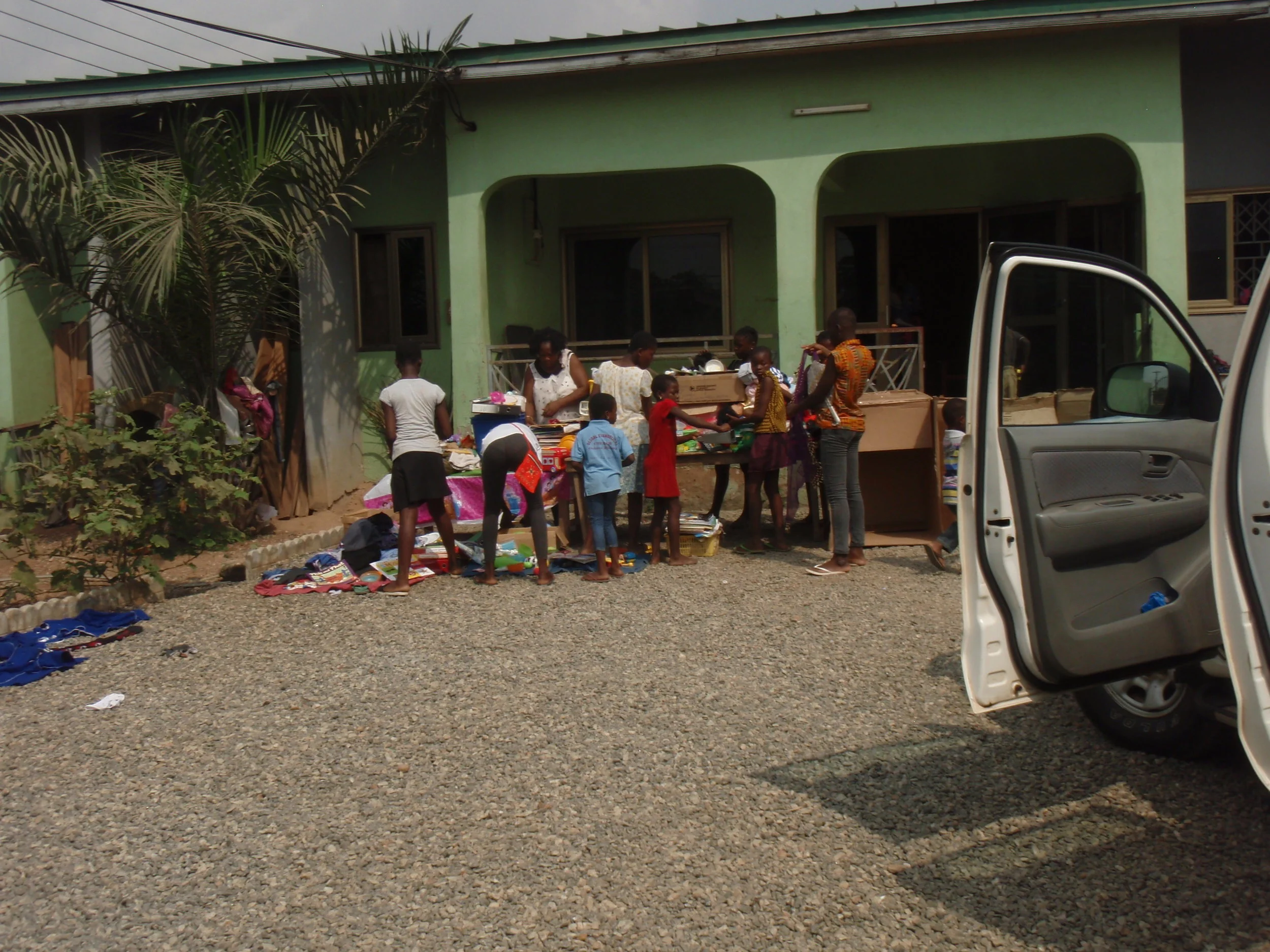  Children at (HC) orphanage Ghana look through the gifts they receive. 