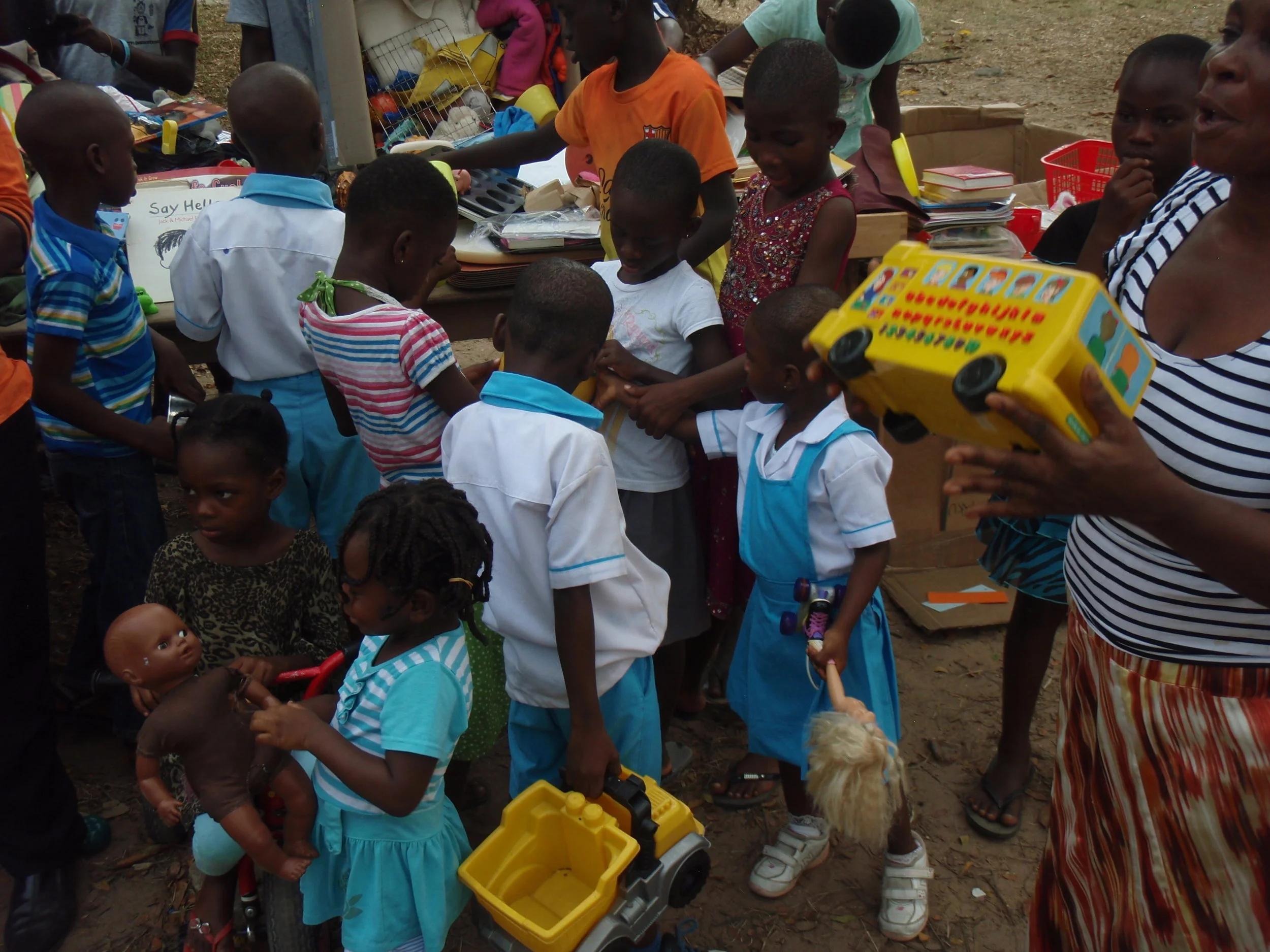  Looking through their gifts at (VOH) orphanage Ghana. 