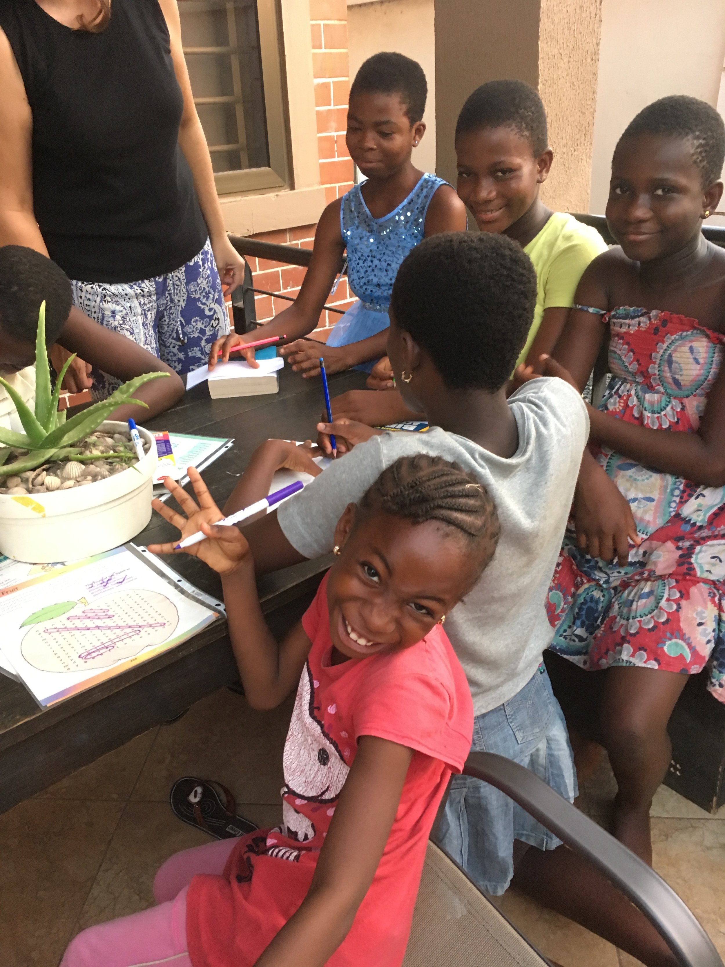 Children in (SGAC) writing thank you letters to NDF.