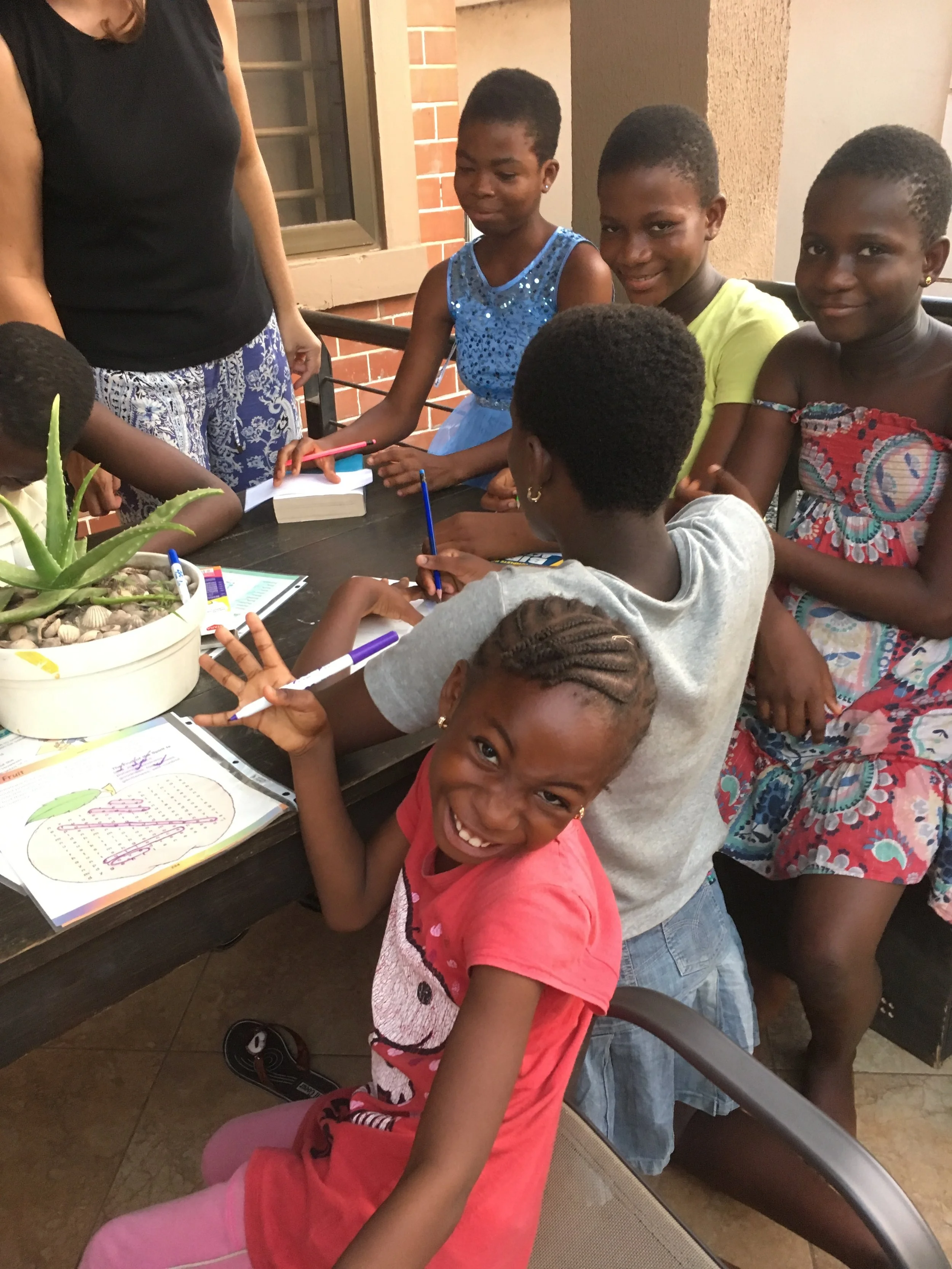Children in (SGAC) writing thank you letters to NDF.