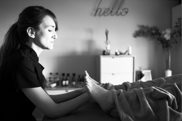 Jo doing reflexology in black and white.png