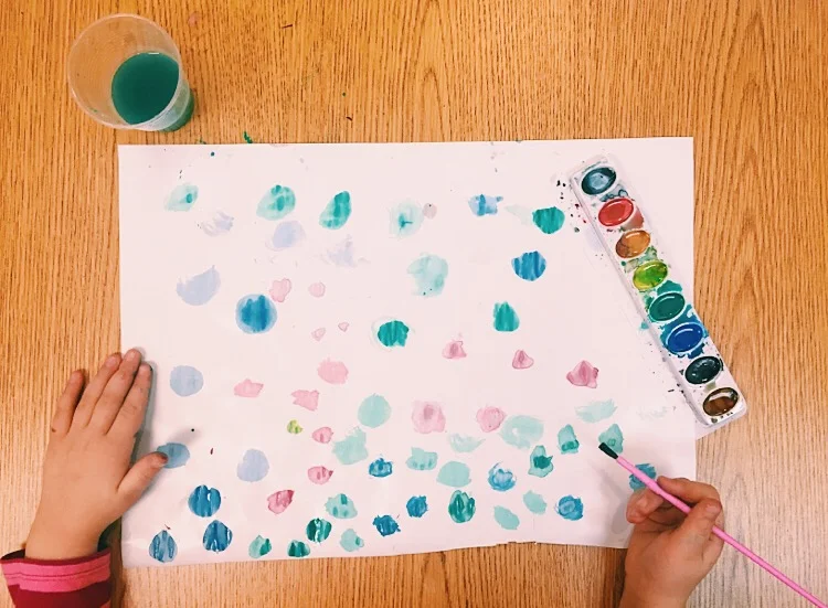 Four year old student experimenting with texture in watercolors