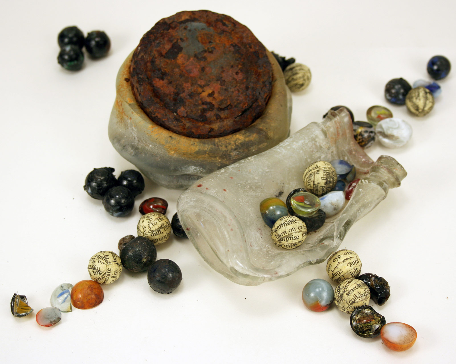 Anthony recovers lost marbles: Two jars and marble fragments