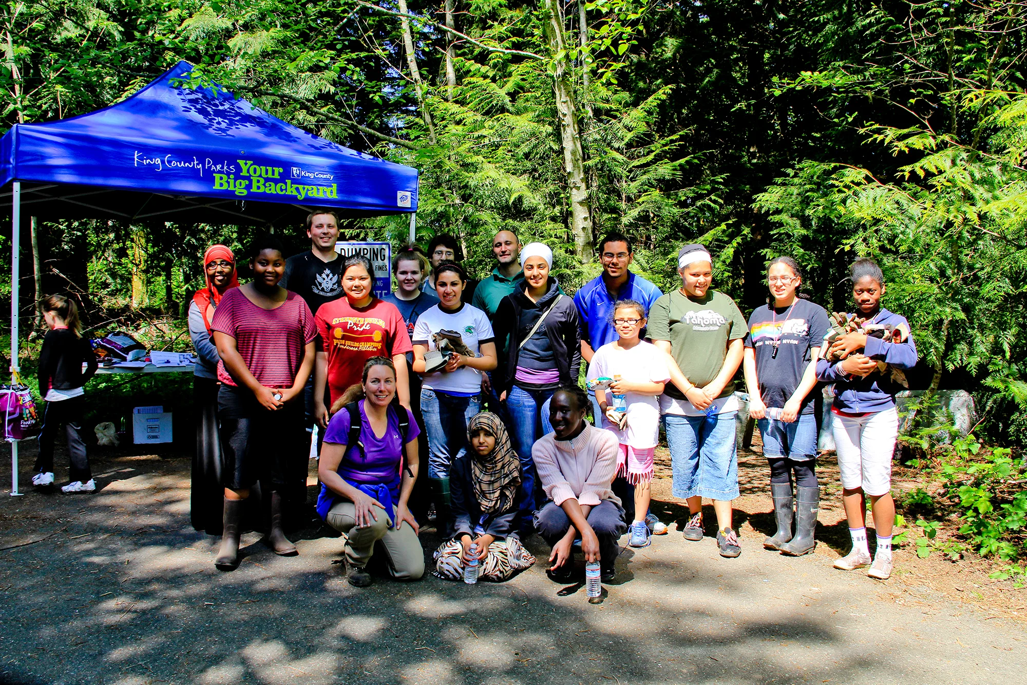 Lisa Parsons (bottom left) working with King County Parks and a group of students on the trails in Cedar Creek park