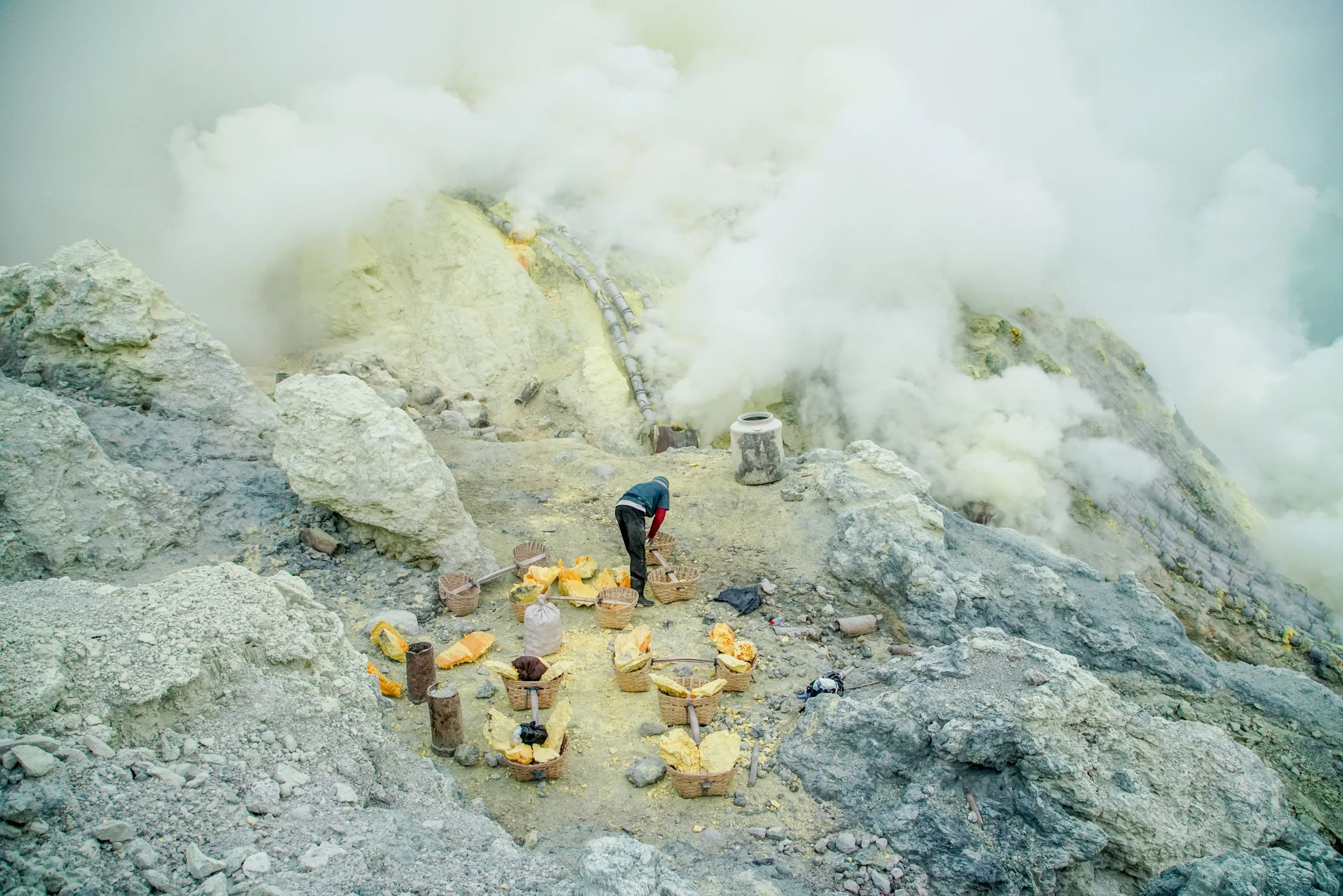 A miner organises his sulfur just after dawn in the crater of Kawah Ijen. 