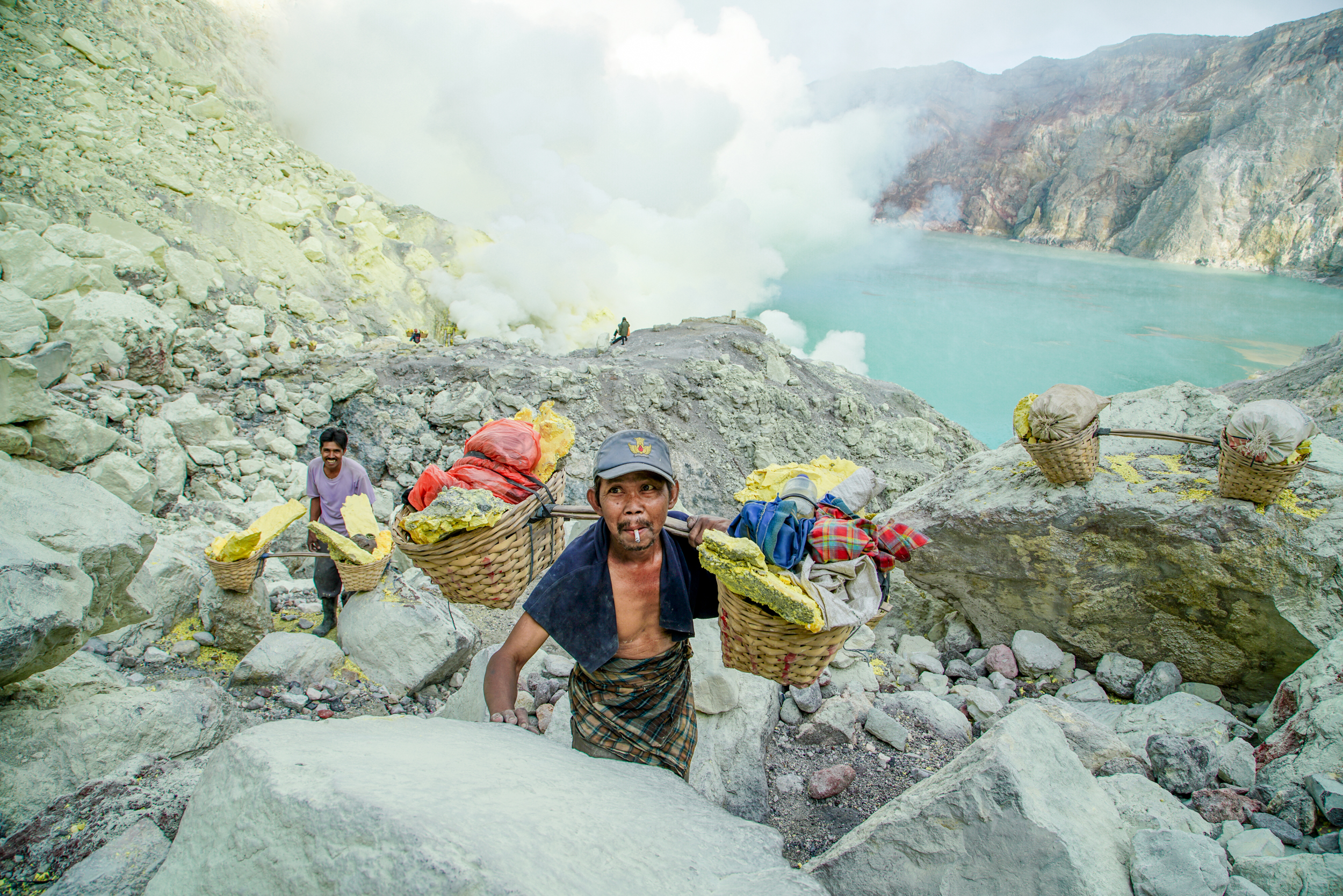 The miners now rely on a few extra rupiah posing for tourists' photographs. 