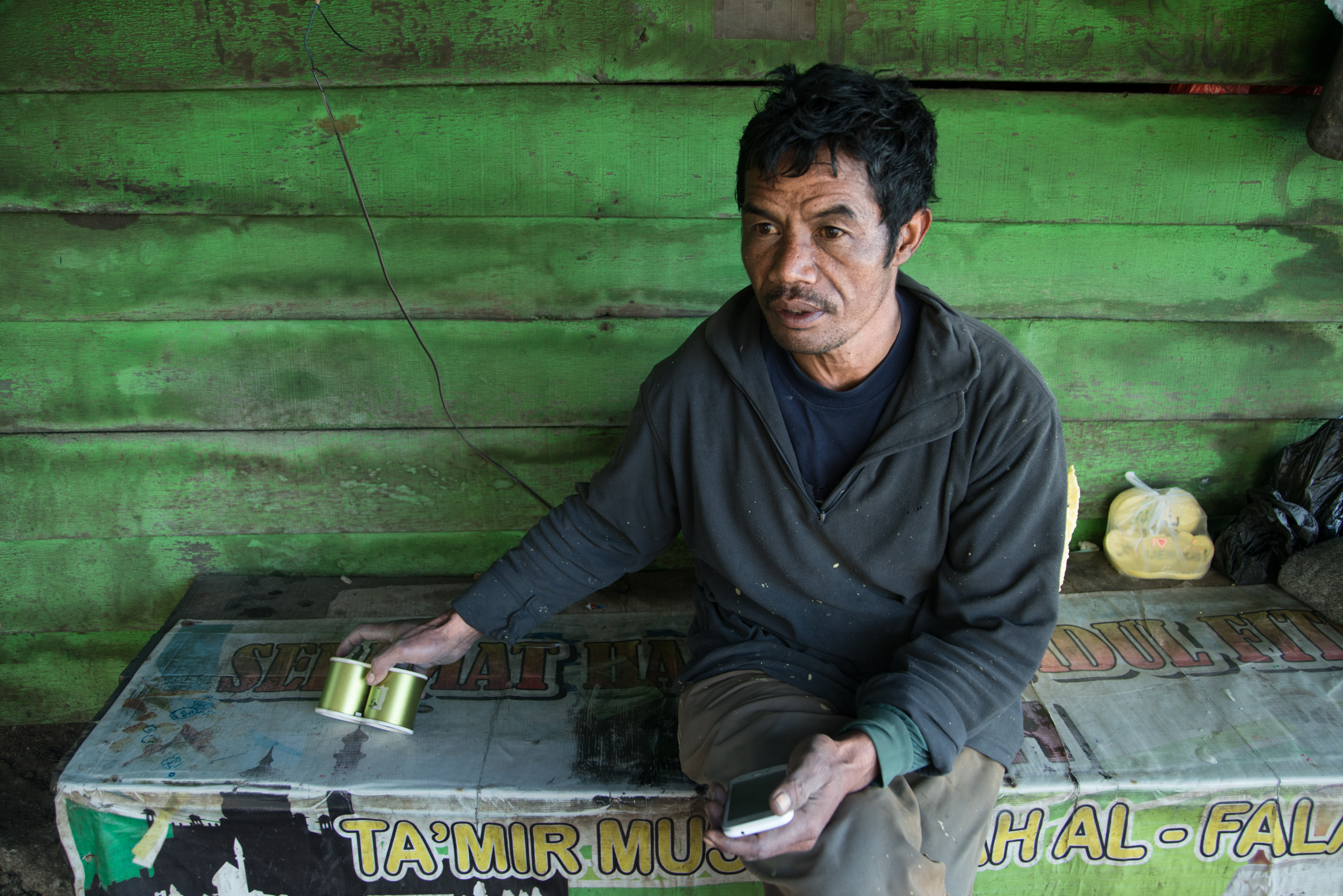 Arifin is also the mine's communications officer. He calls a Java radio station each day to let them know the conditions at Ijen for tourists. 