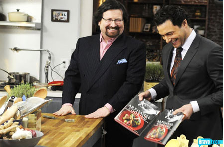 Terrance showing off his book, Artisanal Cooking, on Bravo's Rocco's Dinner Party.