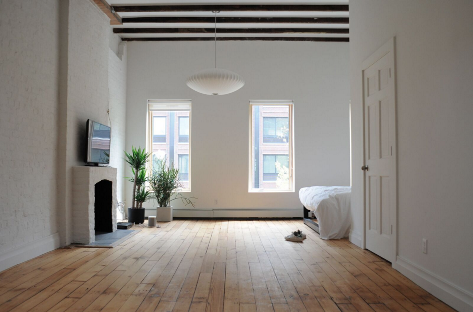 Bedroom side of brownstone opened up to loft style sensibility. 