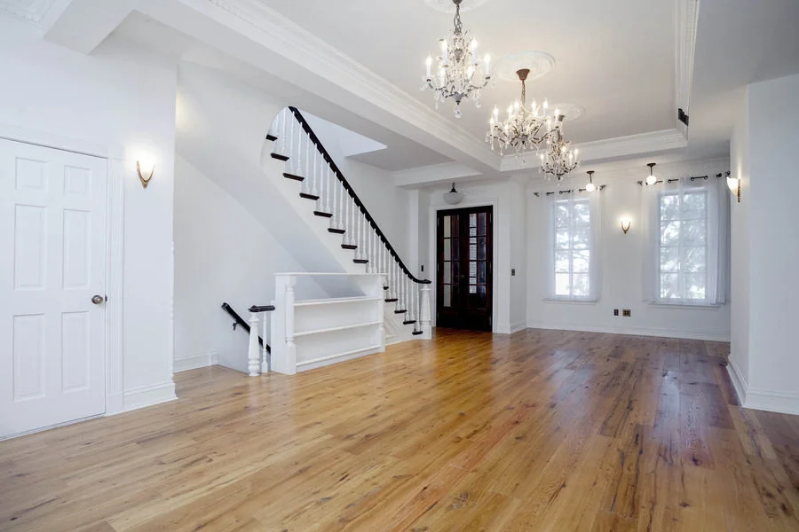 Re-imagined Victorian parlor level with restored staircase and reclaimed wide oak flooring.