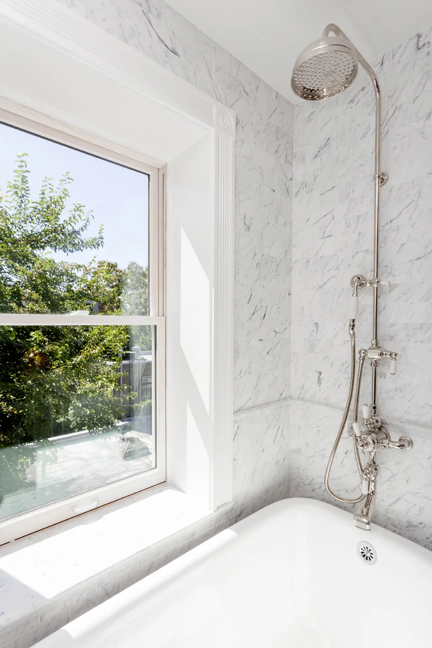 Calacatta marble bath with Lefroy Brooks fixtures.