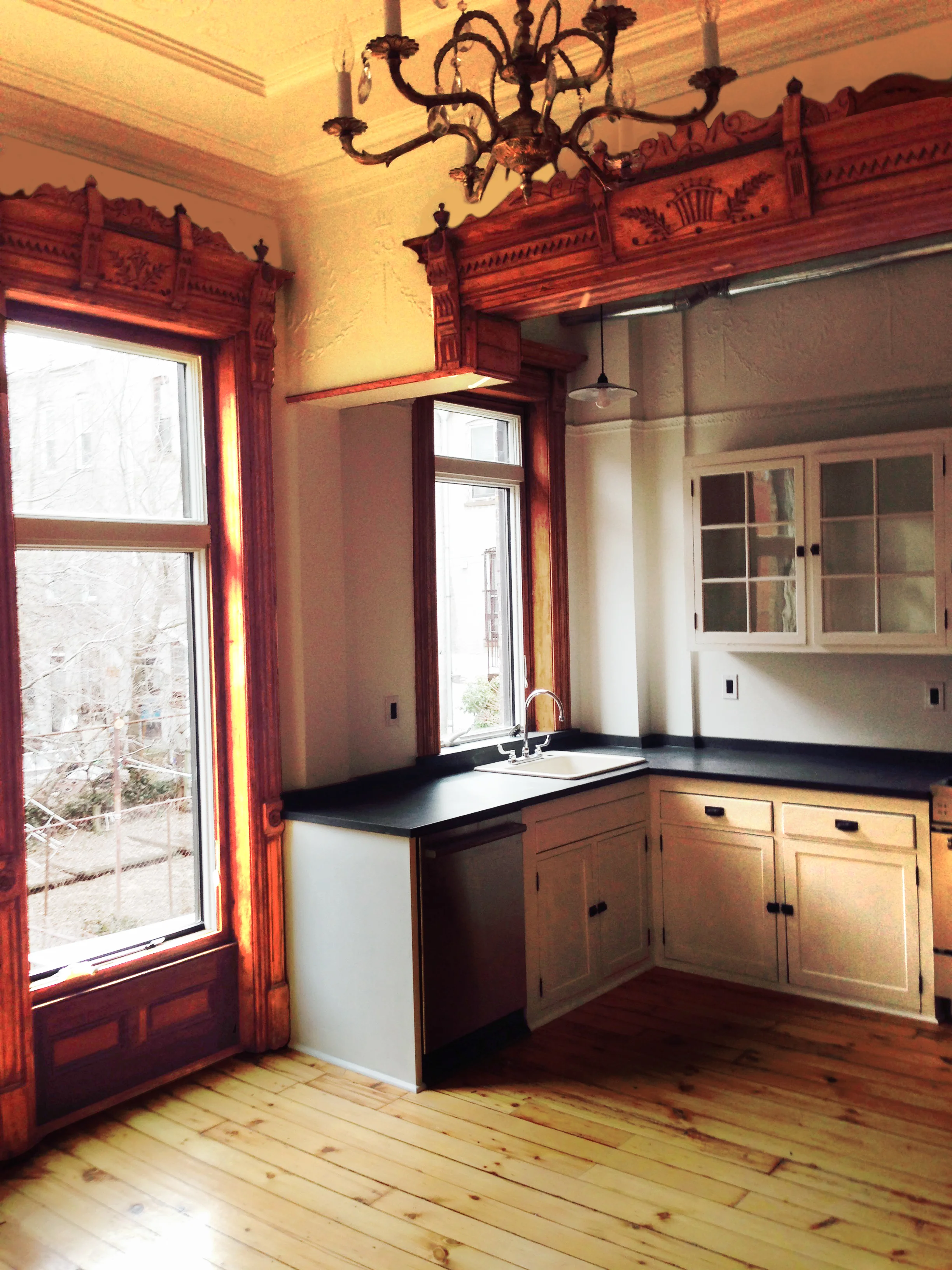 Painstaking woodwork and floor restoration, kitchen cabinets from found objects.