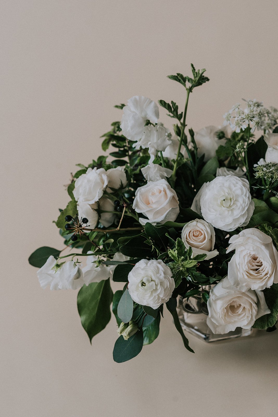 Cream-colored, garden-inspired floral centerpiece for weddings, parties, events