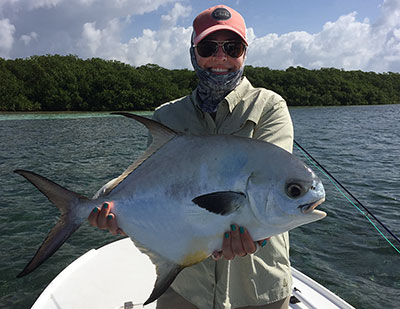 Big permit caught by a happy fly angler