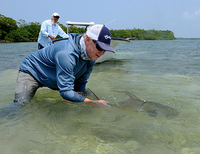 Catch and Release of a permit while fly fishing in Belize