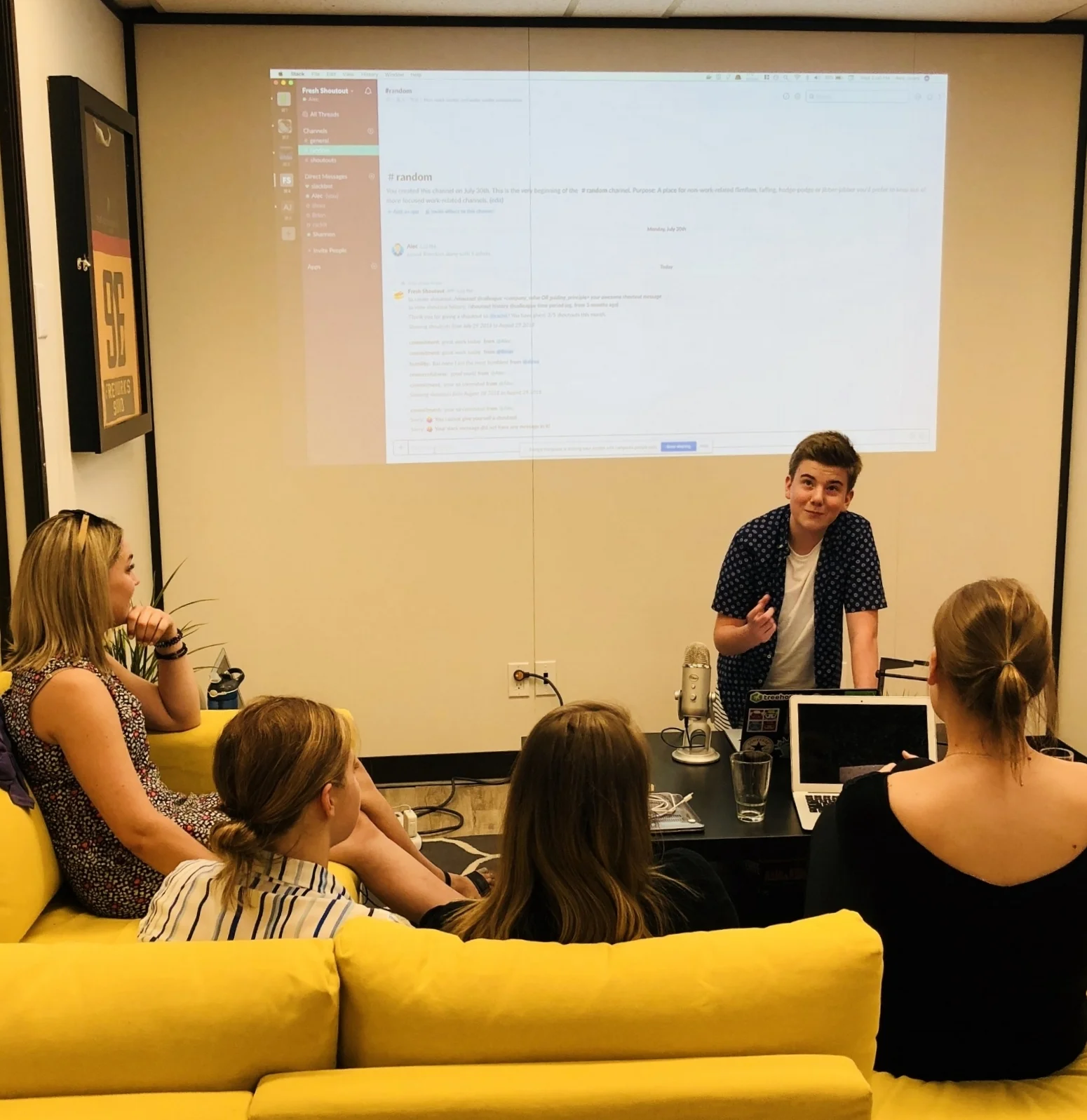 Alec showing off his work to our team during demo day