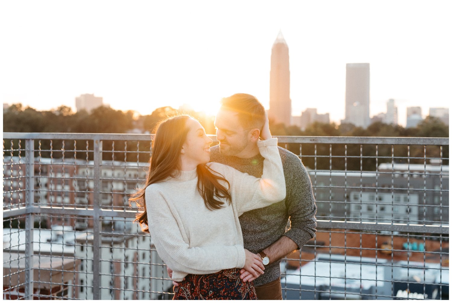 Atlanta engagement photos show a couple on the Roof at Ponce City Market at sunset
