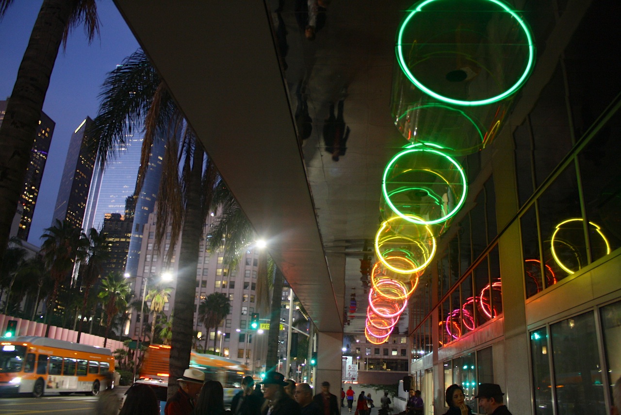 Michael Hayden, Generators of the Cylinder, 1982, 270′ x 11′, Cylinders: 4′ x 4′ x 2′, infrared sensors, holographically etched polycarbonate, stainless steel panels and neon lights