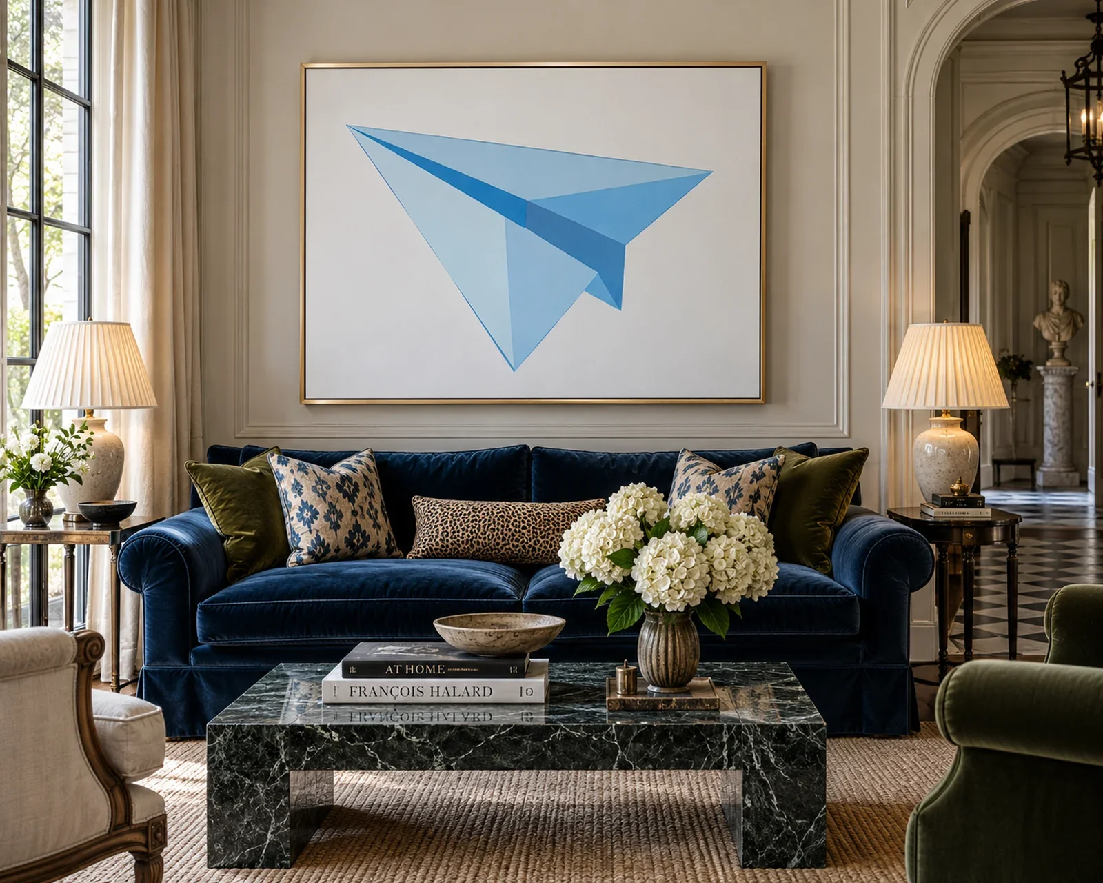 lue paper airplane artwork above a velvet sofa in a traditional living room.