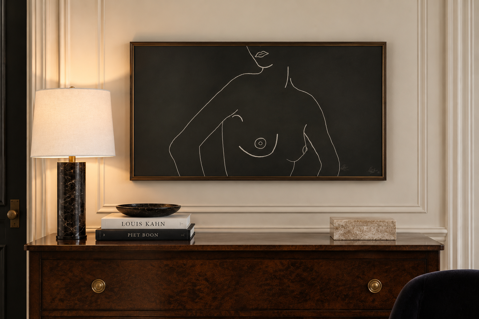 Contemporary figure drawing in a simple frame above a wood dresser in a traditional interior.