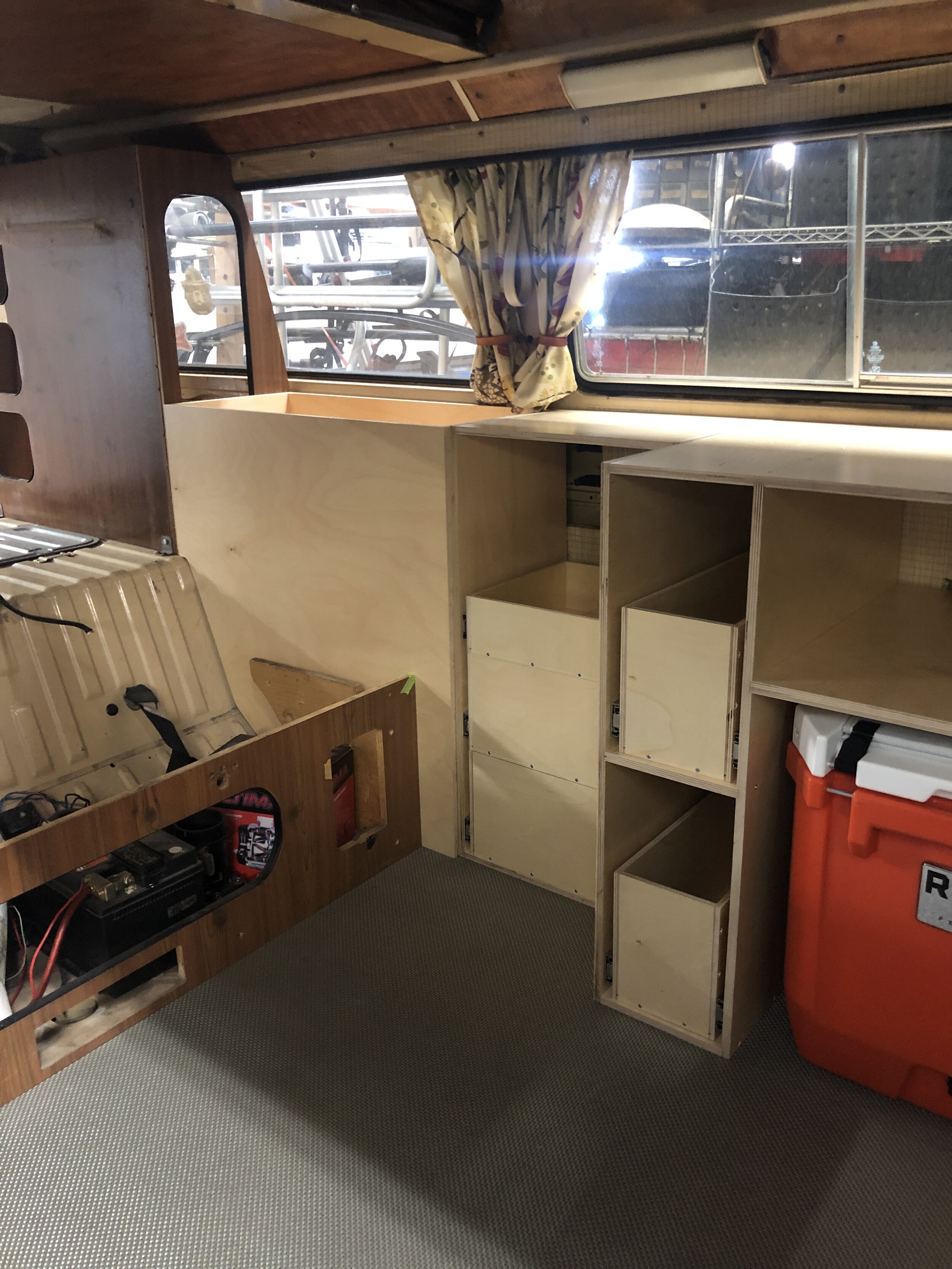 Custom cabinetry building involved restoration of some original Westphalia camper cabinets and design/build of new ones that incorporated the clients wish list.