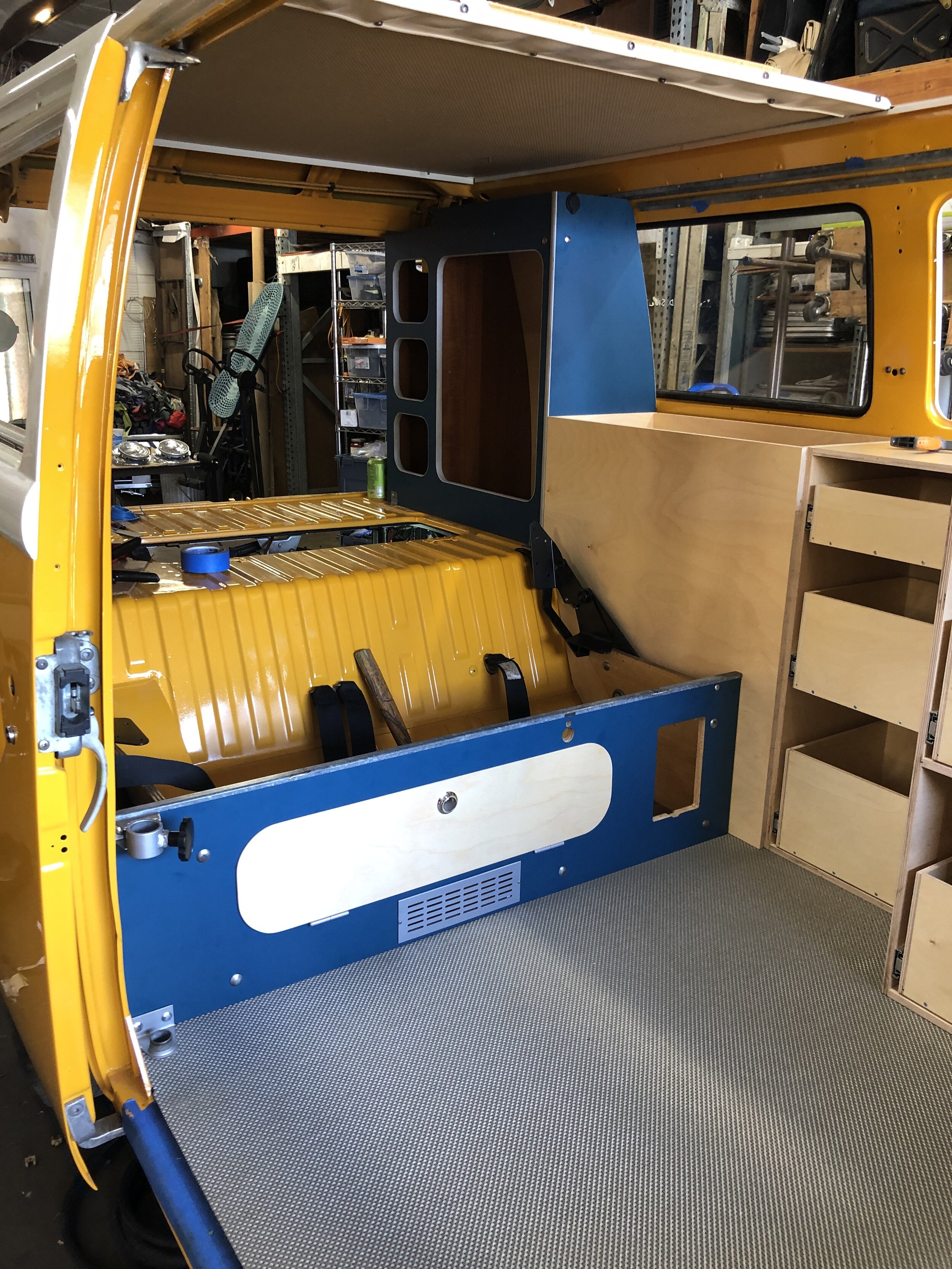 Custom cabinetry building involved restoration of some original Westphalia camper cabinets and design/build of new ones that incorporated the clients wish list.