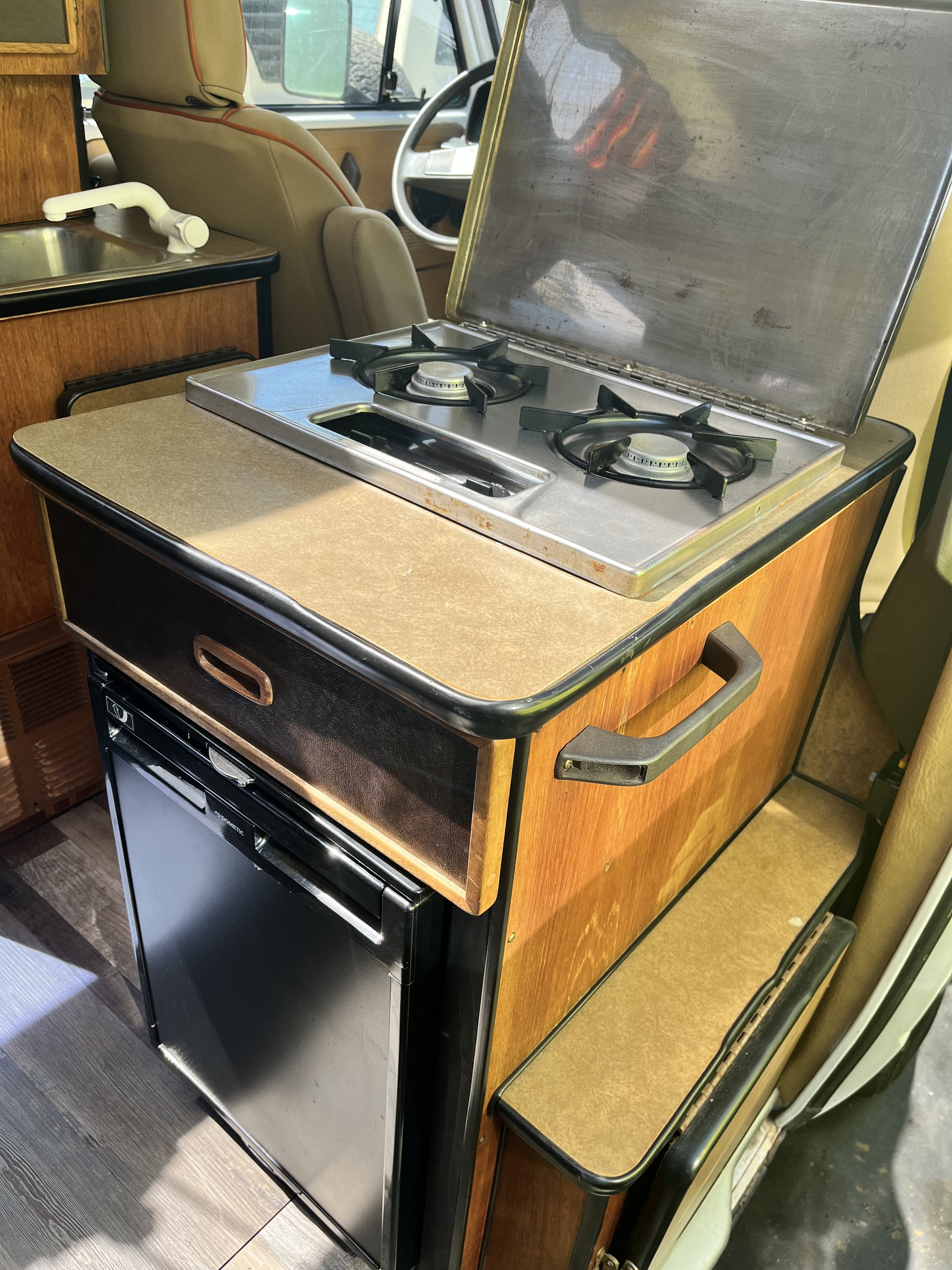 2 burner propane stove, new Dometic frige, fold out side table