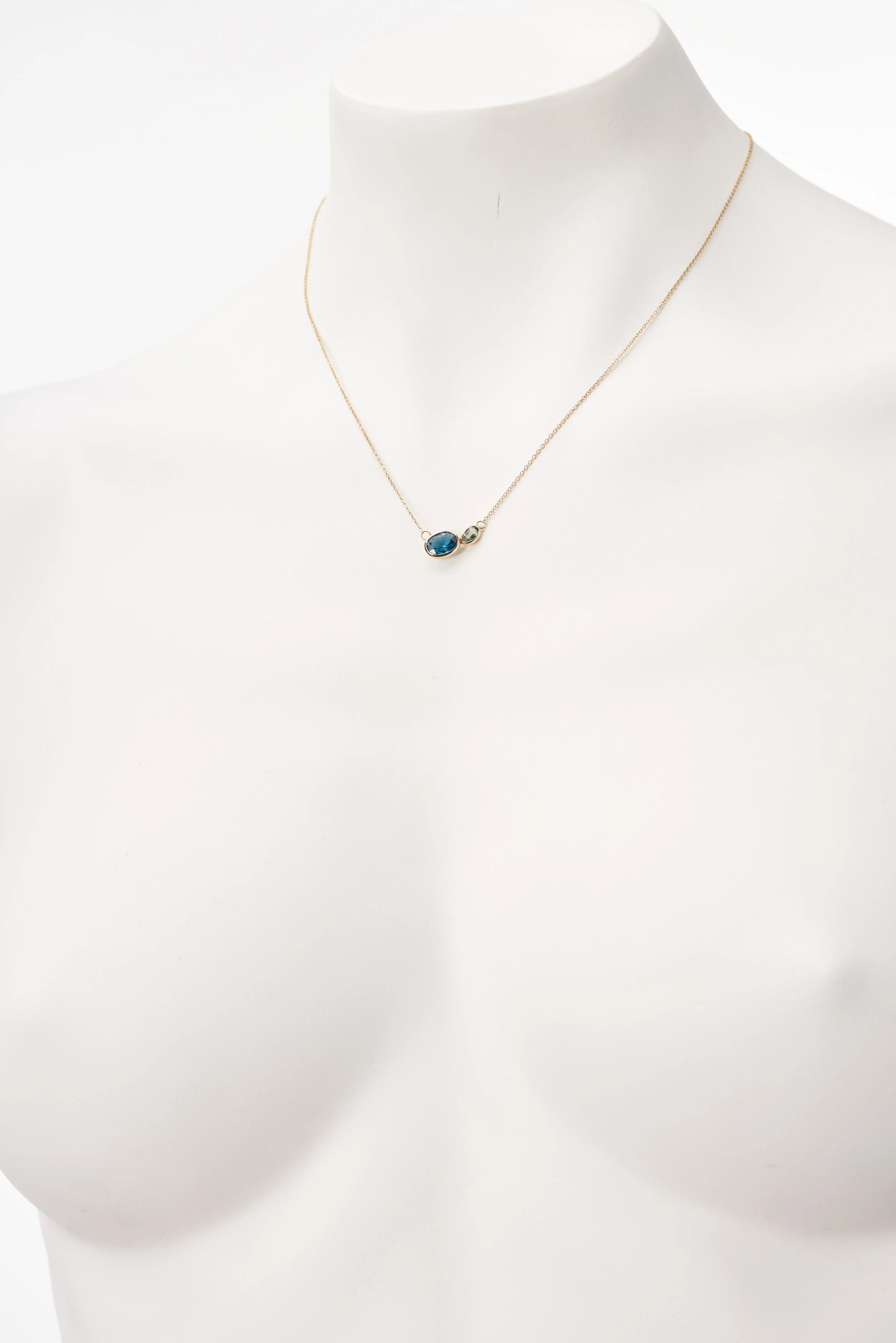 18-2789_Necklace_Two Bezel_Blue Topaz_Green Saphire_YG_Front_1906.jpg