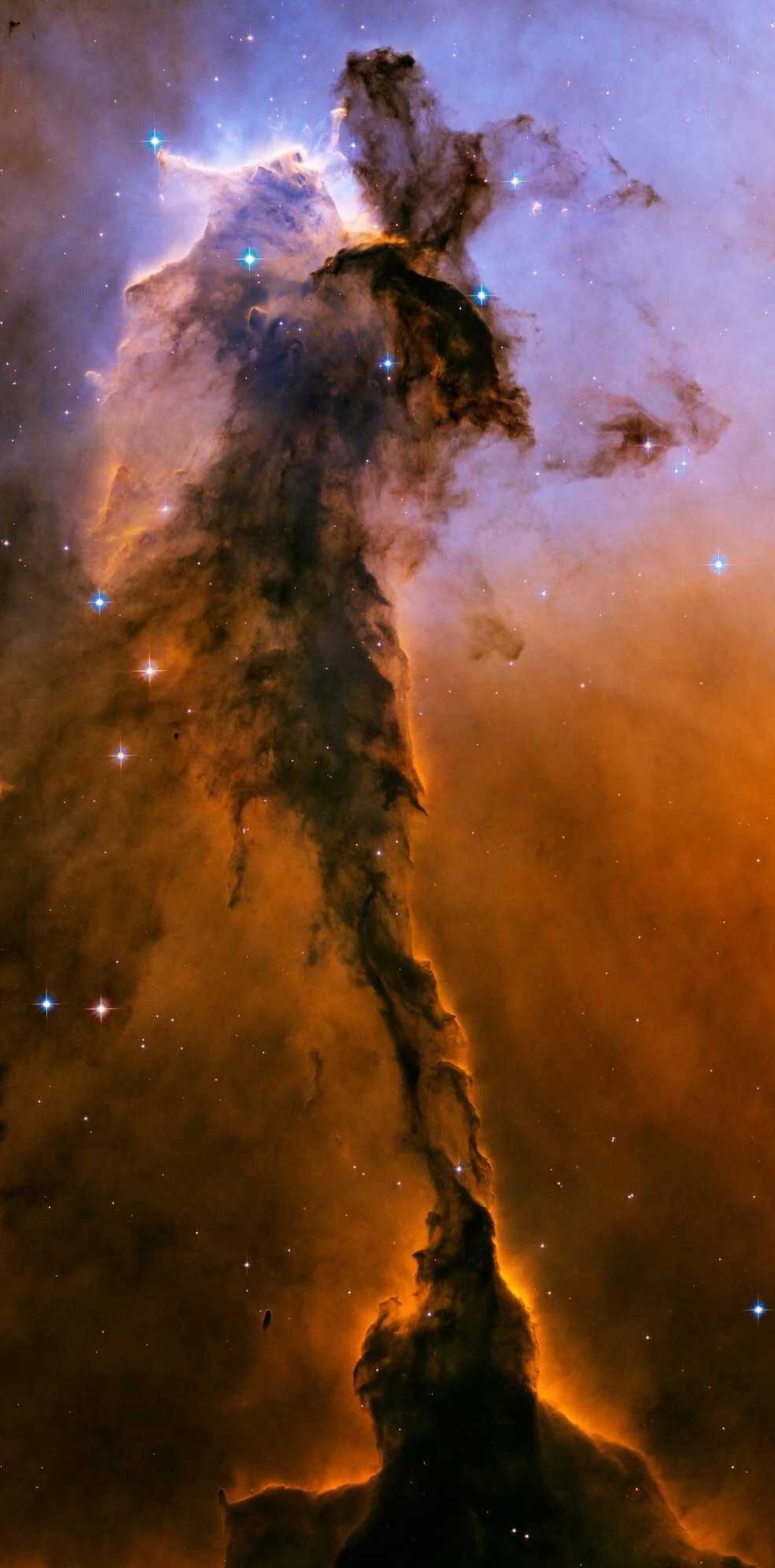 Eagle Pillar Cloud:  A gigantic cloud-like tower of gas stretching 9.5 light-years (about 57 trillion miles) above the Eagle Nebula. In the centre, the protrusions and bumps that jut out from the main body are roughly the size of our entire solar system. Credits: NASA, ESA and the Hubble Heritage Team (STScI/AURA)