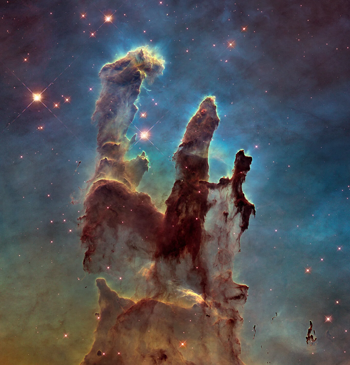 Pillars of Creation in Messier 16 (Eagle Nebula):  The aptly named Pillars of Creation, featured in this stunning Hubble image, are a small part of an active star-forming region within the Eagle Nebula and hide newborn stars in their wispy columns. This Nebula is located about 7,000 light years from Earth and spans 70 by 55 light years. The “pillars” themselves stretch roughly 4 to 5 light years. The blue colors in the image represent oxygen, red is sulfur, and green represents both nitrogen and hydrogen. Credits: NASA, ESA and the Hubble Heritage Team (STScI/AURA)