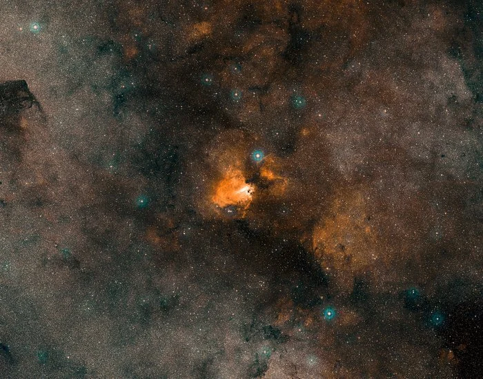 Omega Nebula:  A colour composite of the Omega Nebula (M17) made from exposures from the Digitised Sky Survey 2 (DSS2).  Credit: ESO/Digitised Sky Survey 2. Acknowledgment: Davide De Martin.