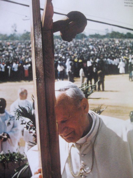 Pope John Paul II (St. John Paul the Great) praying before a black crucified Christ in Angola in the late 20th century. Pope John Paul II canonized St. Faustina on the Feast of Divine Mercy in 2000 and instituted the feast for the universal Church. The man himself died on the vigil of Divine Mercy Sunday in 2005. He was beatified by Pope Benedict XVI on the Feast of Divine Mercy in 2011 and was canonized on the same feast by Pope Francis in 2014. 