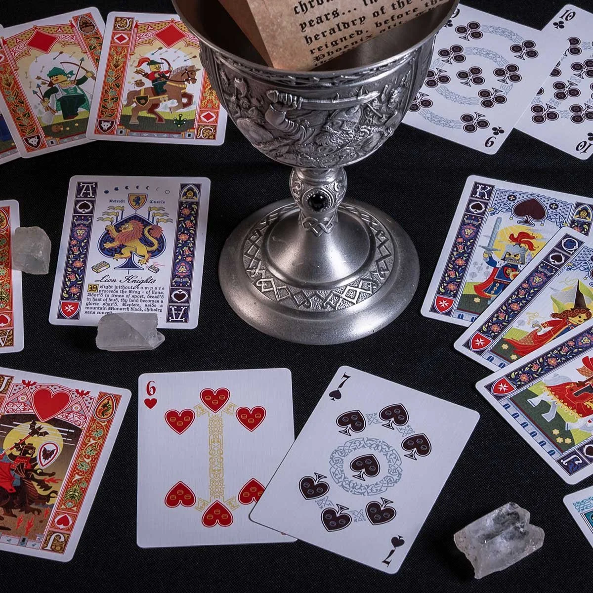Six Seven and scattered LEGO castle cards with crystals