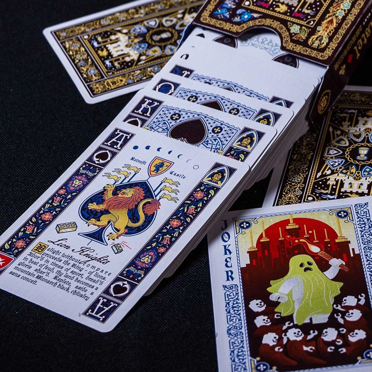 Ace of spades and other LEGO castle cards spilling from the tuck box
