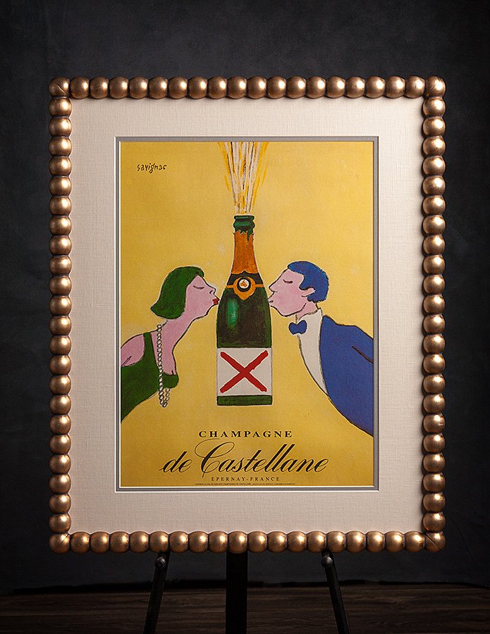  An antique champagne poster on linen was framed with fabulous “bubble” moulding from Gryphon. 