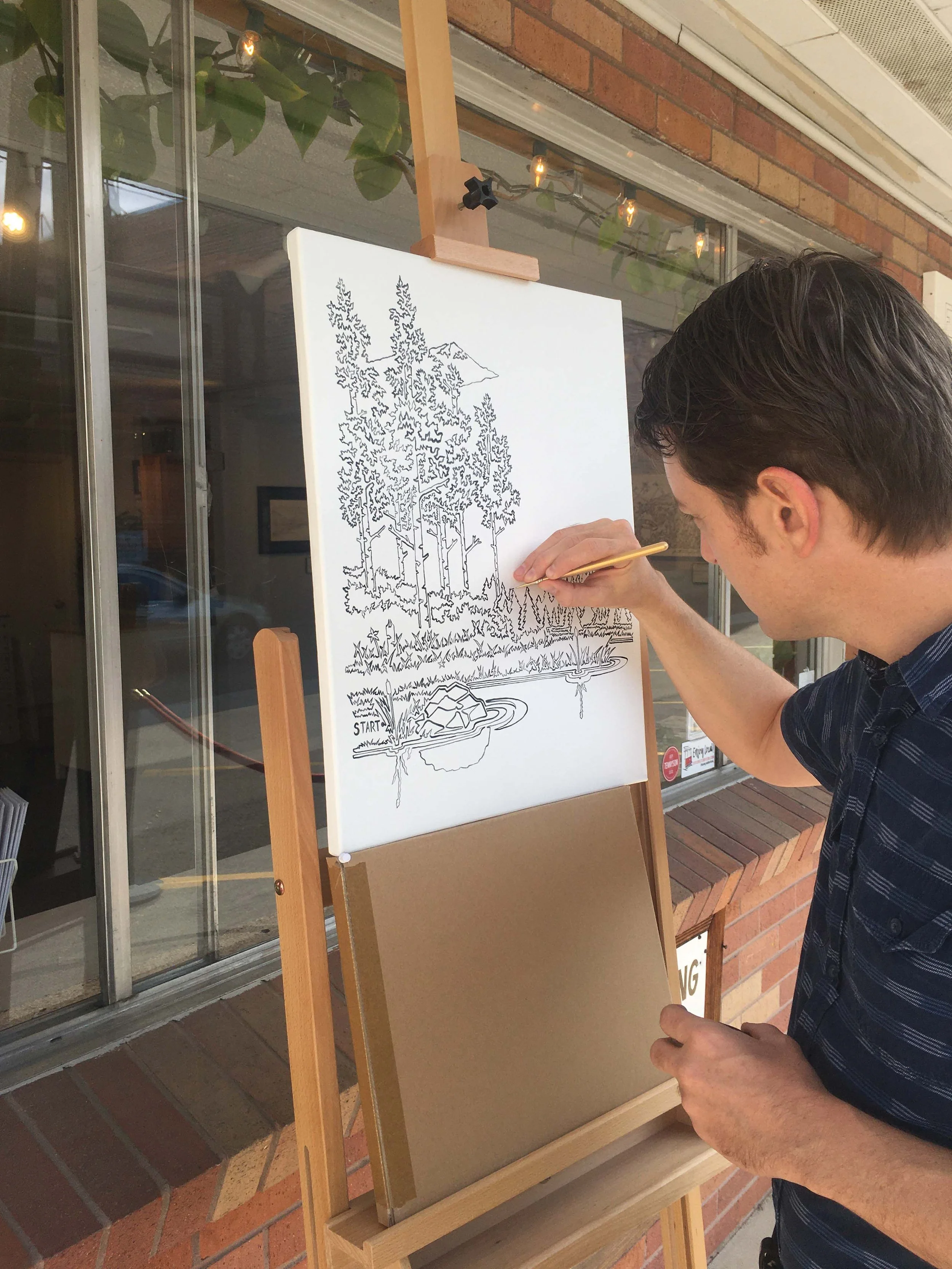 Jonathan Applegate painting in his oneLINE style infant of th eFuture Drawn oneLINE Gallery