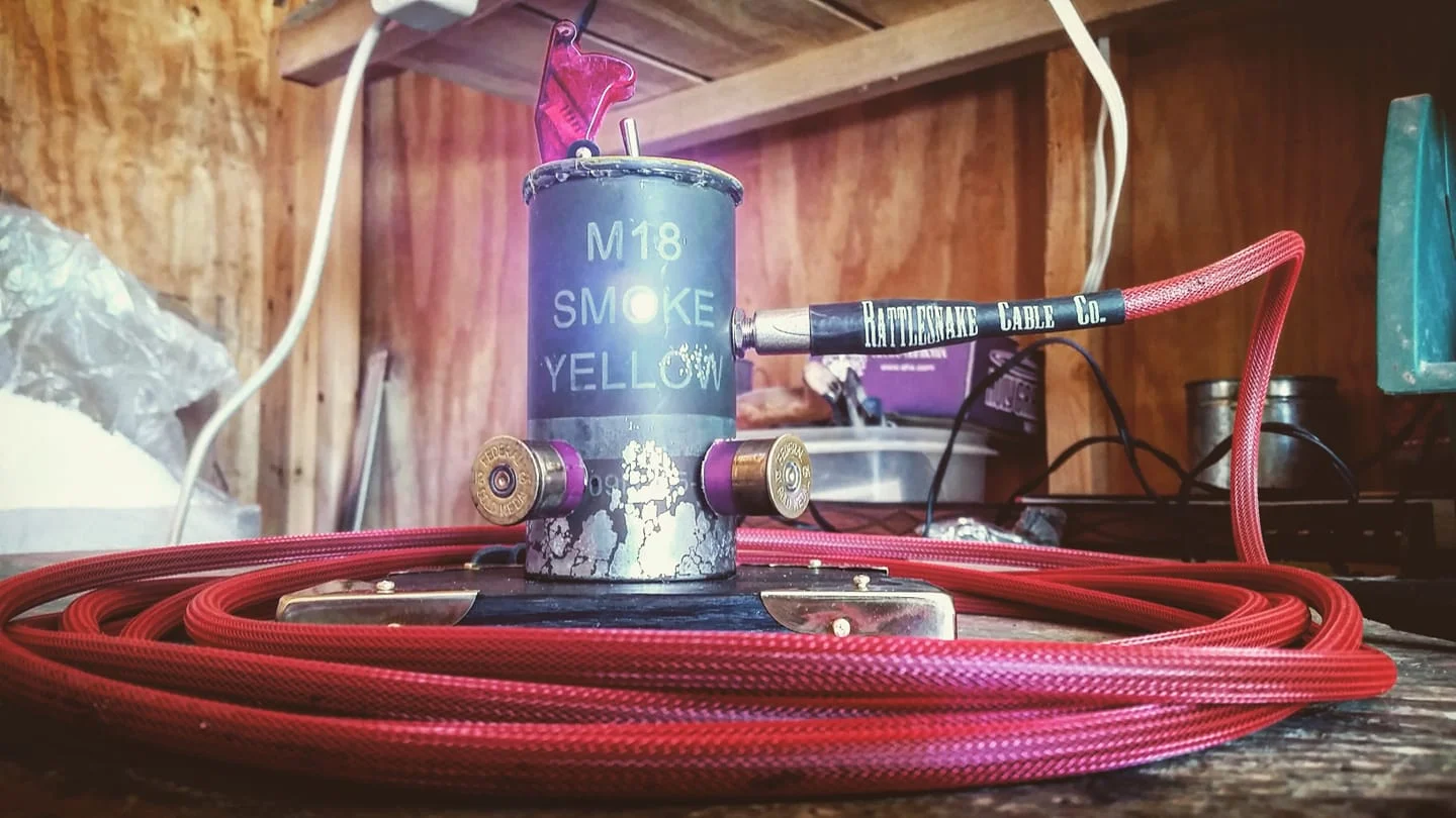 The grenade cannister amp, featuring a Rattlesnake Guitar Cable (also MT made!).