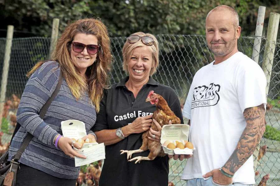 CASTEL FARM EGGS - big thanks to Emma Brooks and the team at Castel Farm Eggs who donated 5p for every box of eggs sold over a three-month period. Raising a whopping £4,125.00 Sonia and Geoff with Emma Brooks (Centre)