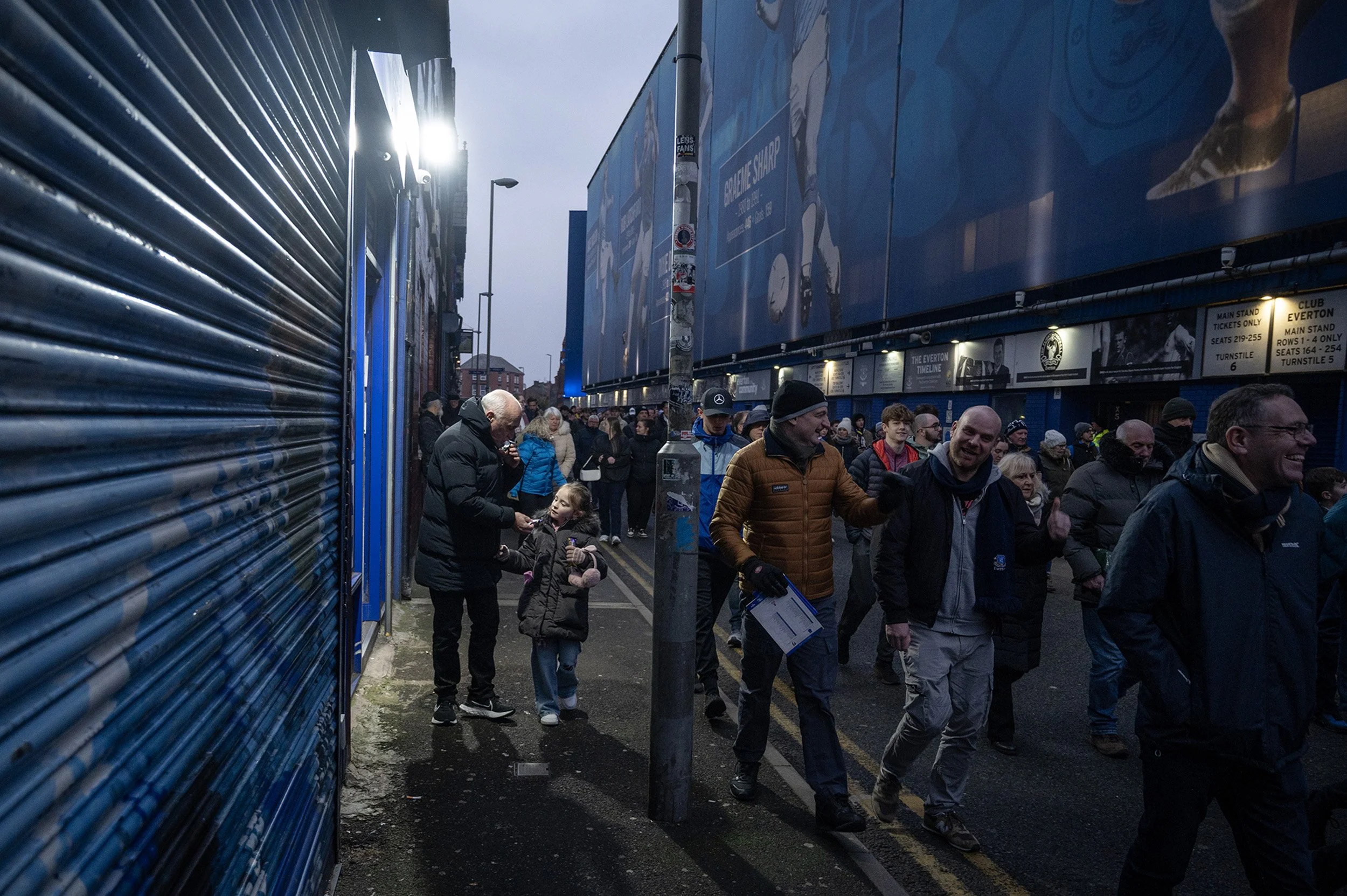  For a year I walked the streets around Goodison, watching the Autumn light of the first days of the football season turn to a flat grey before we basked in the Spring sunshine of the final game. I watched that changing light slip down walls of the h