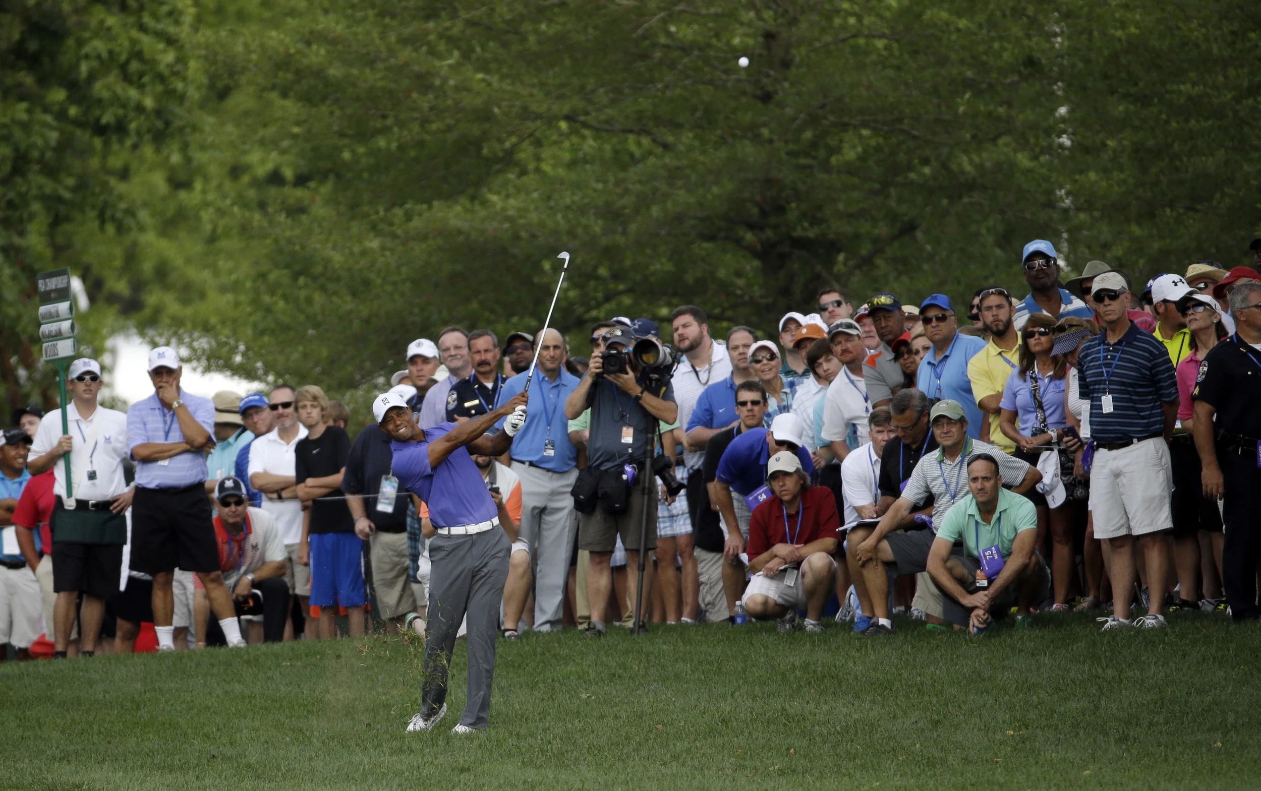 My day job is as an editor at Golf Digest. That's me (front right, green shirt) shadowing Tiger Woods at the PGA Championship.