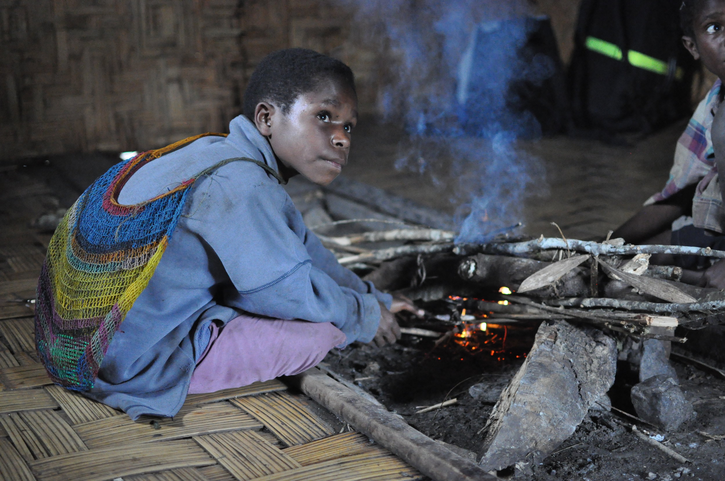  Children stoke a fire at our residence. Gua, 2009. 