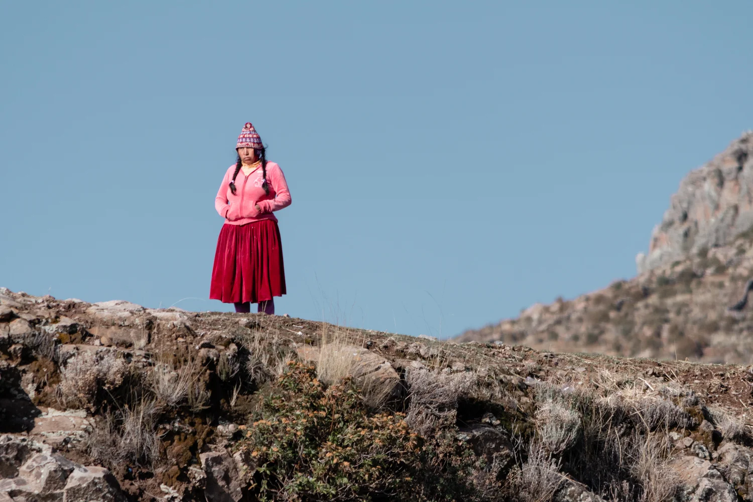 The Aymara-speaking islanders are distinct from most of the surrounding Quechua-speaking island communities and maintain a strong sense of group identity.