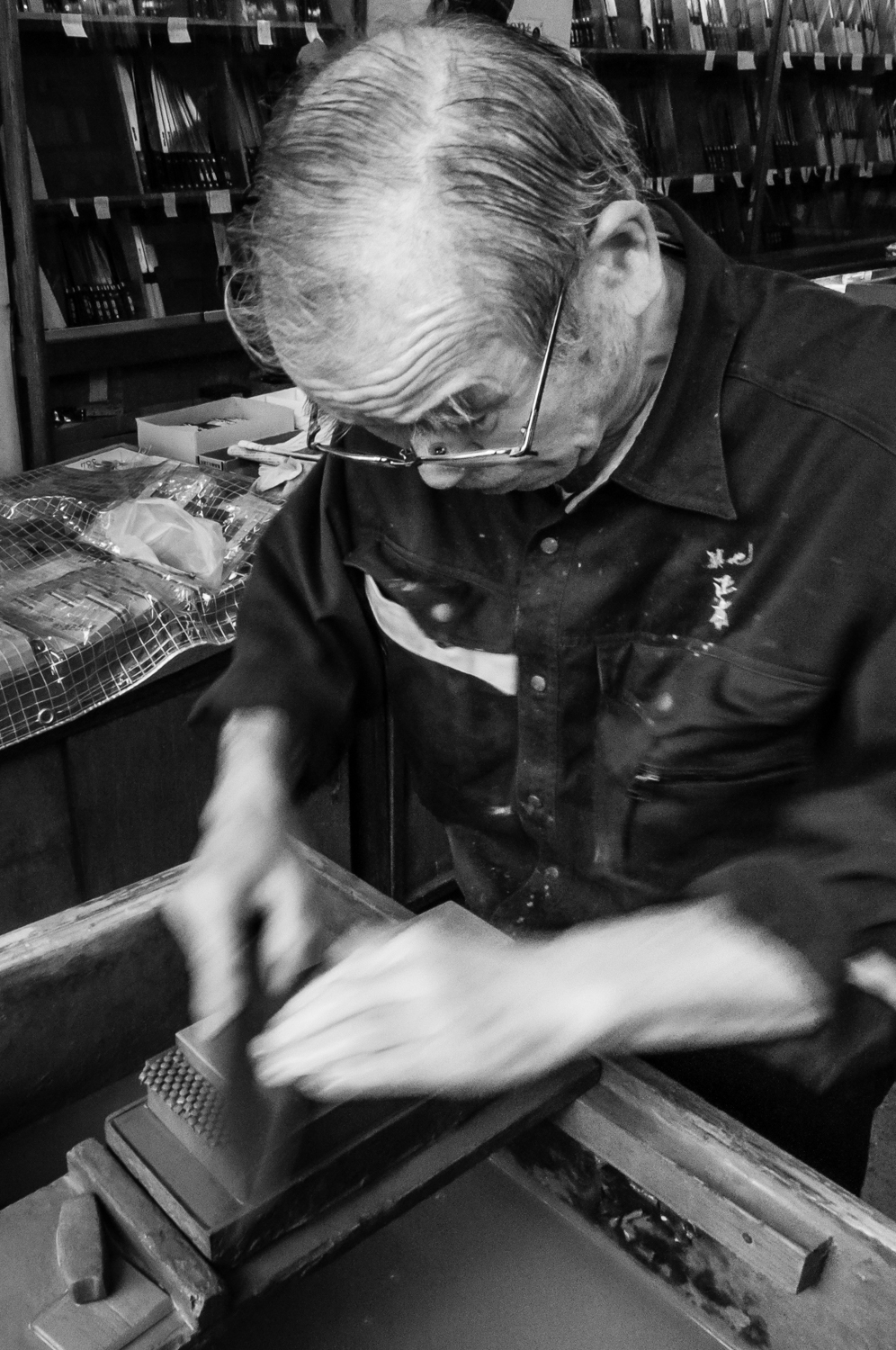 An artisans sharpens the cutlery the old way, before it gets sold to the customers.
