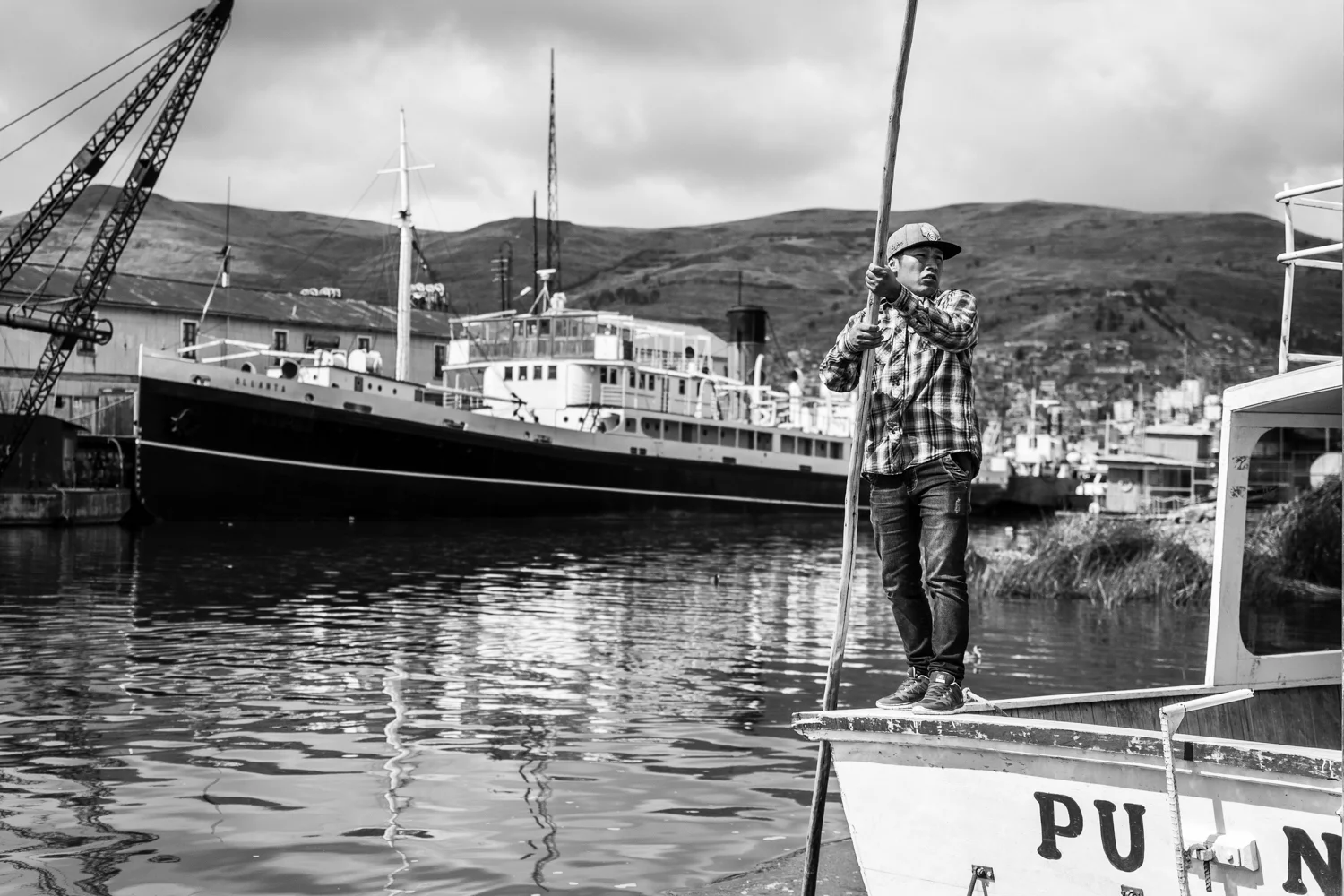 A sailor is ready to take off as he carries locals and tourists from the city of Puno to the islands. Tourism on lake Titicaca has become a decent source of revenues for a lot of families, as the fishing industry is collapsing.