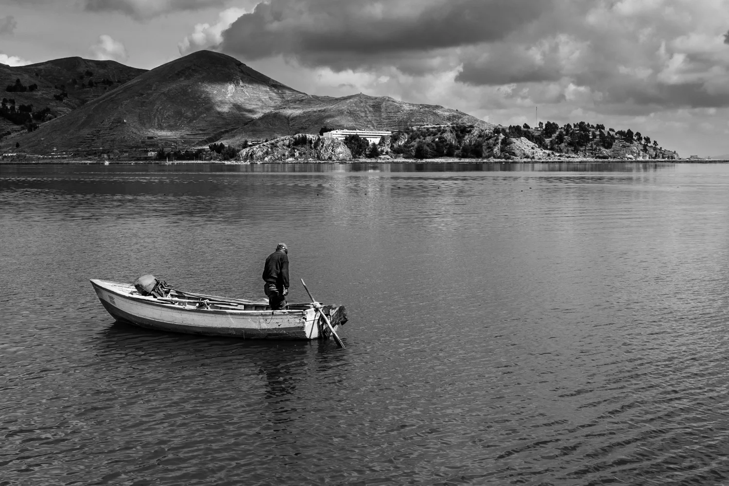 A fisherman struggles everyday to get some fish in a lake that has witnessed years of intensive exploitation of its natural resources. Only bigger boats belonging to fishing corporations are now able to catch something bigger than killifish, even though there is not much left.