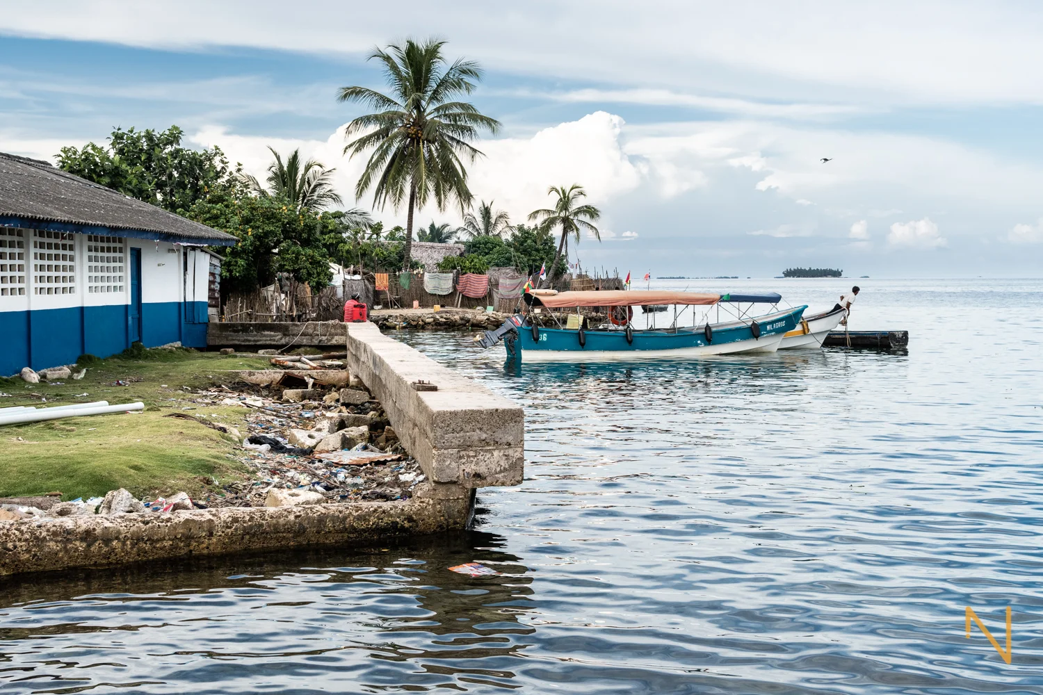 In an attempt to stop the waters and reclaim land from the sea, rudimental barriers are made with a rocks, dead corals, sand and sometimes trash.