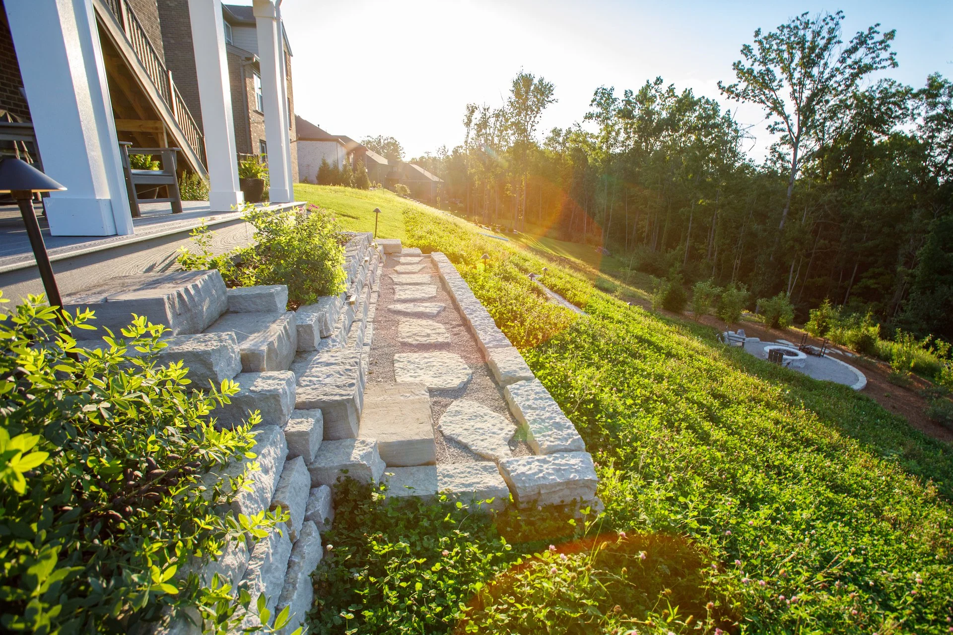 We specialize in designing hardscaping for steep slopes, small urban yards, underused lawns, and awkward leftover spaces that need hardscaping, grading, and plantings to work together.
