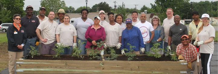 (Above) VSU staff and faculty are joined last fall by Sabra Dipping Company volunteers in building raised garden beds at Summerseat. (Below) The “raised cottage” style building on the Summerseat property is believed to have been constructed between 1850 and 1875 and used in the summer for a court by the local magistrate, hence the name “Summerseat.”
